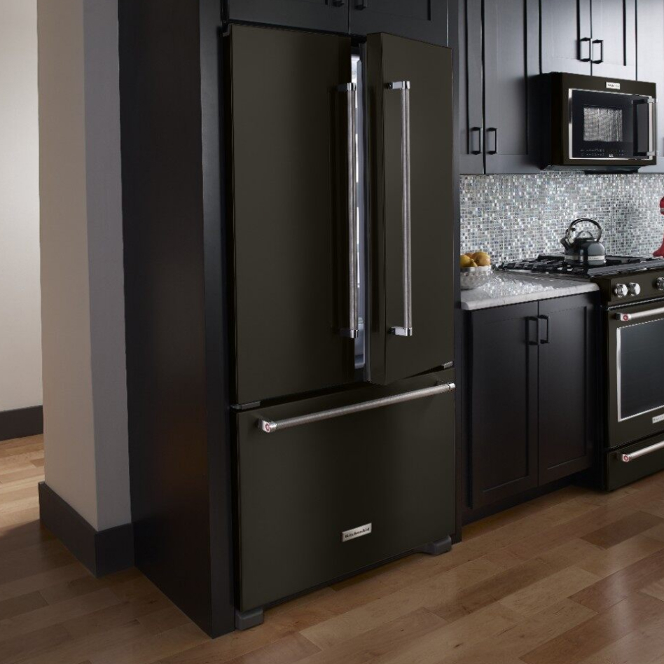 Black stainless steel refrigerator style in dark, modern kitchen Black stainless steel refrigerator style in dark, modern kitchen