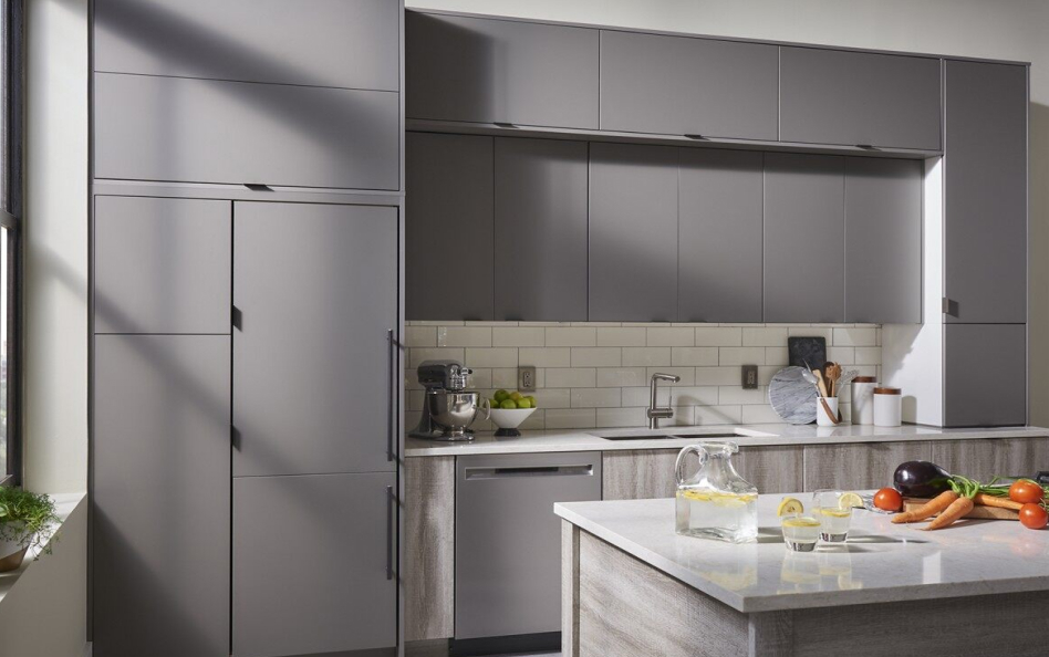 Minimal kitchen with gray cabinets and panel-ready refrigerator Minimal kitchen with gray cabinets and panel-ready refrigerator