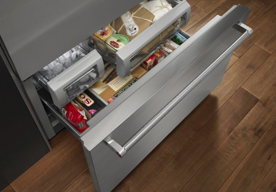Open bottom freezer refrigerator drawer with food inside Open bottom freezer refrigerator drawer with food inside