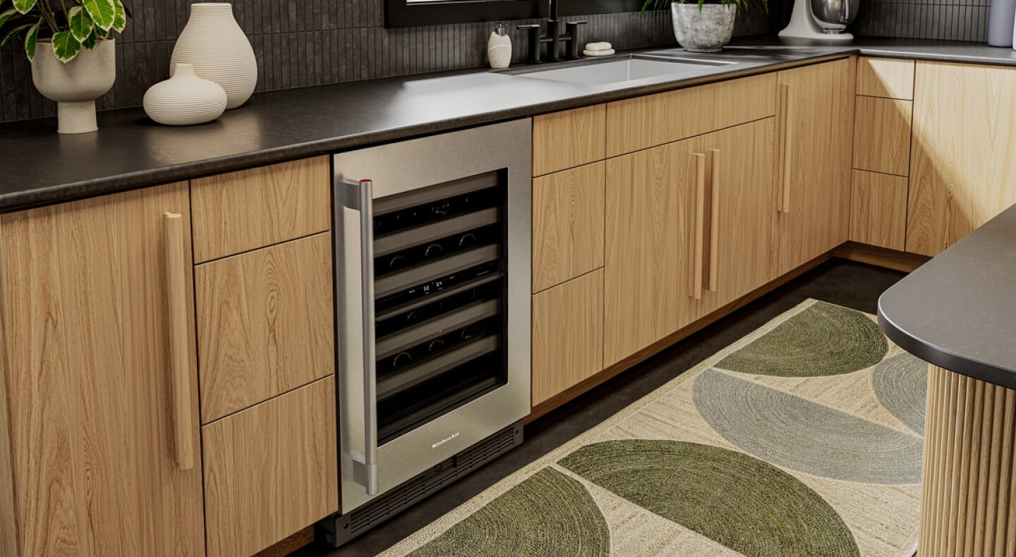 An undercounter refrigerator with wine bottles inside