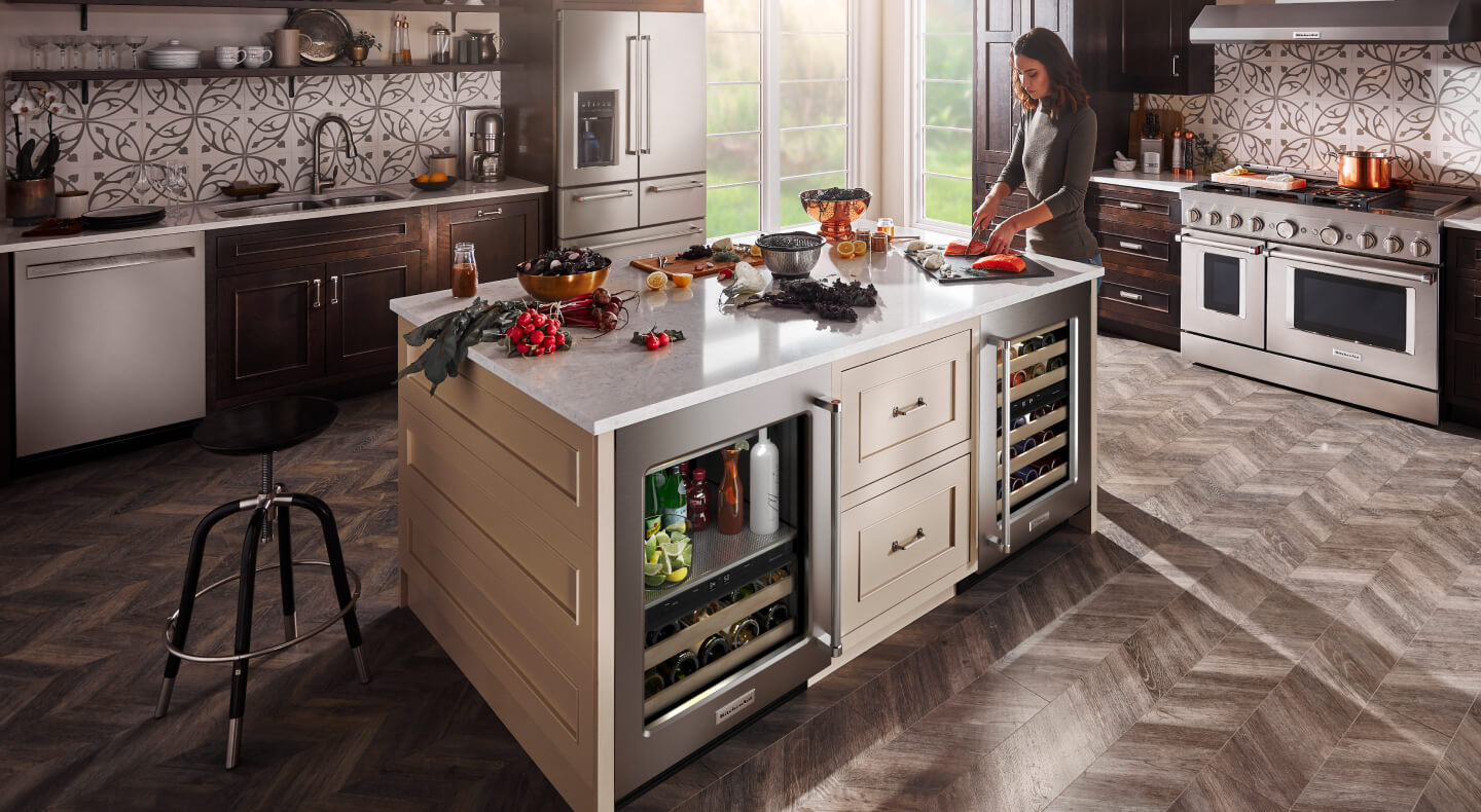 Kitchen island with a built-in beverage center and wine refrigerator
