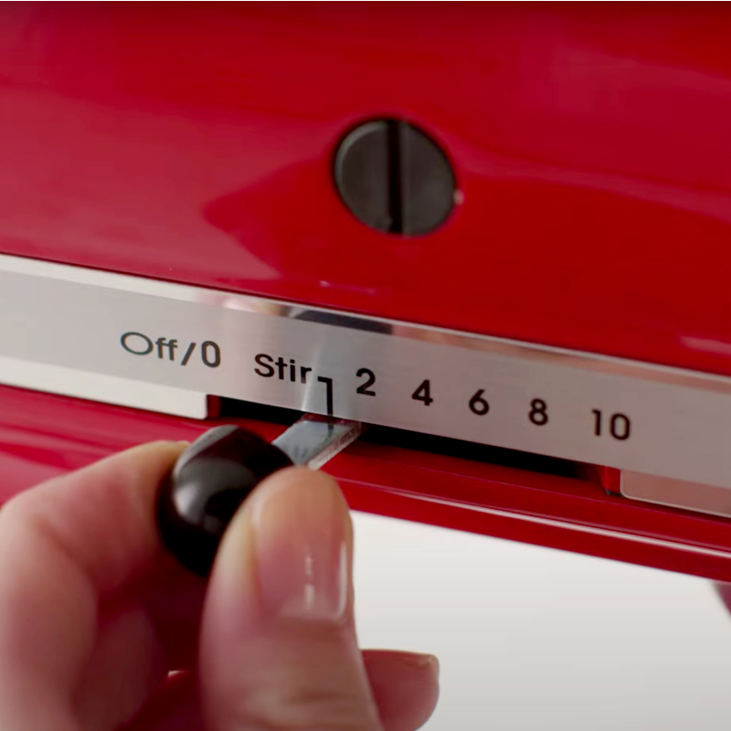 Person turning on a KitchenAid® stand mixer