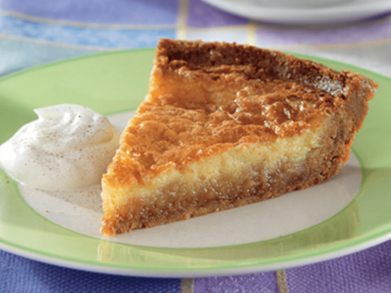 Slice of buttermilk pie on plate Slice of buttermilk pie on plate