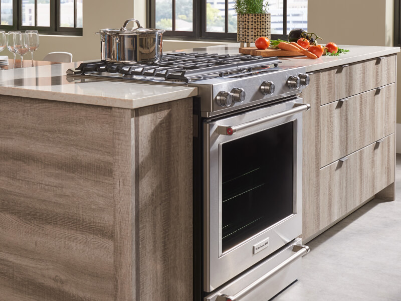 Stainless steel KitchenAid® gas range in a modern kitchen