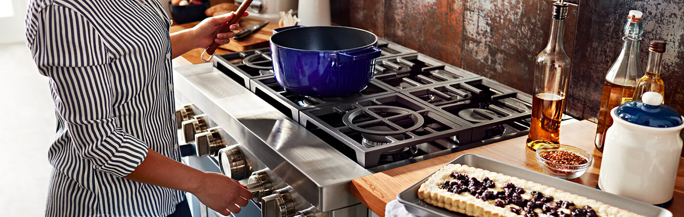 Person cooking on a gas range