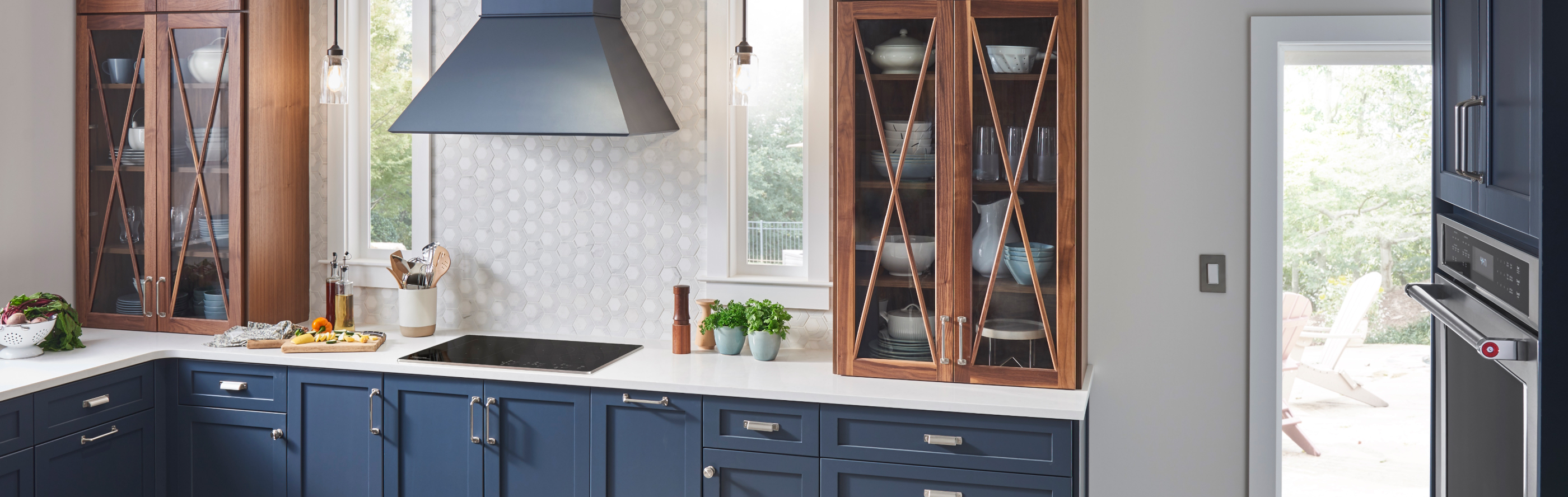 KitchenAid® cooktop and range hood in a modern kitchen