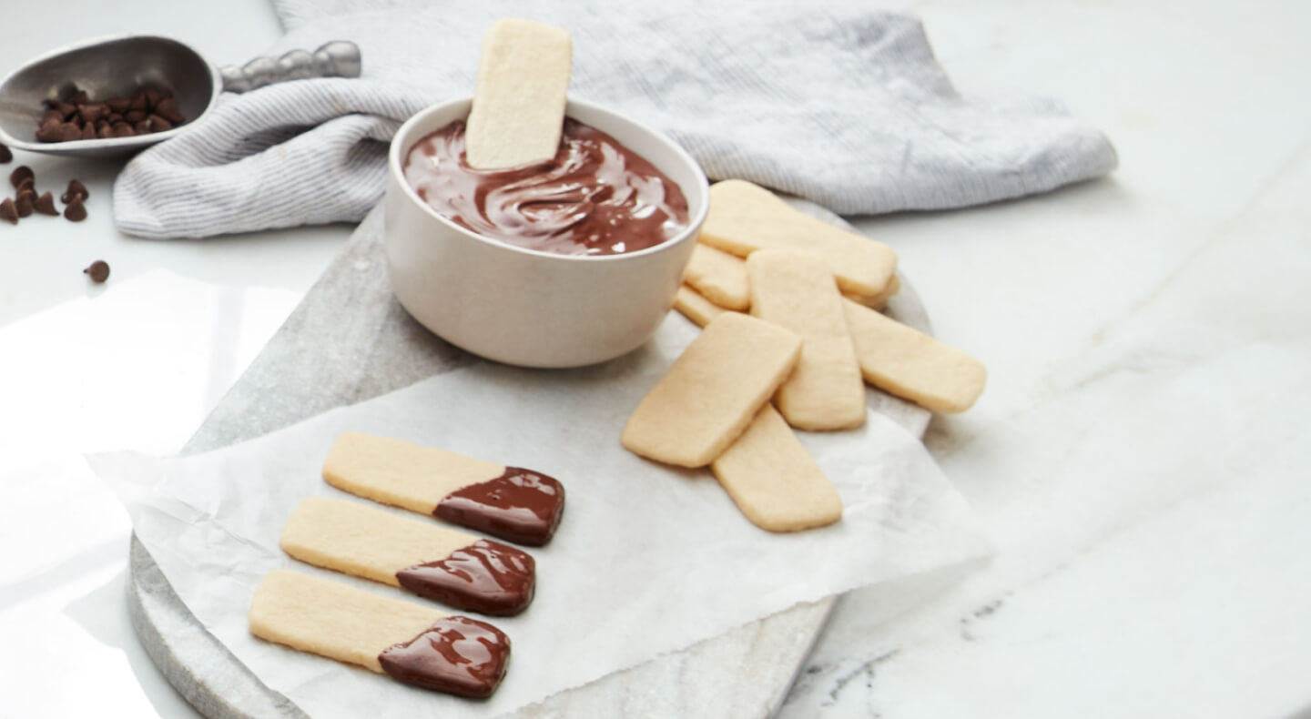 Baked sugar sticks dipped in ganache Baked sugar sticks dipped in ganache