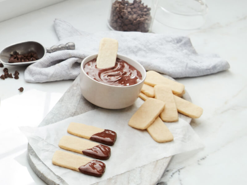 Baked sugar sticks dipped in ganache Baked sugar sticks dipped in ganache