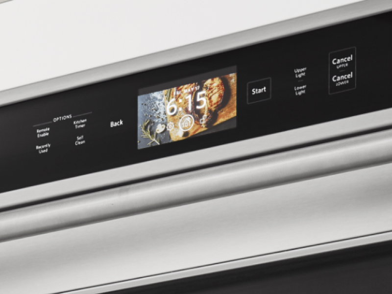 A close up of an oven control panel. 