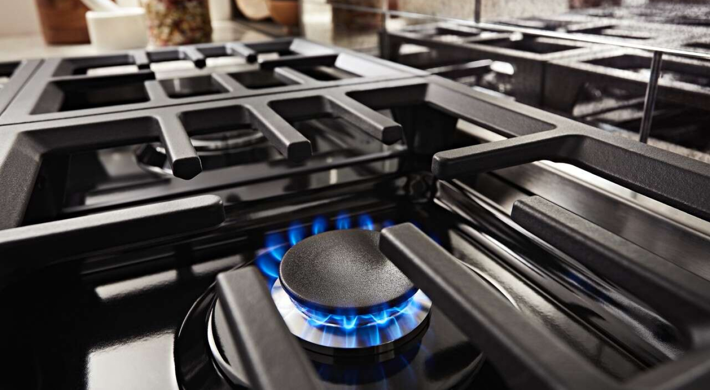 Close-up of the flame of a gas stovetop burner Close-up of the flame of a gas stovetop burner