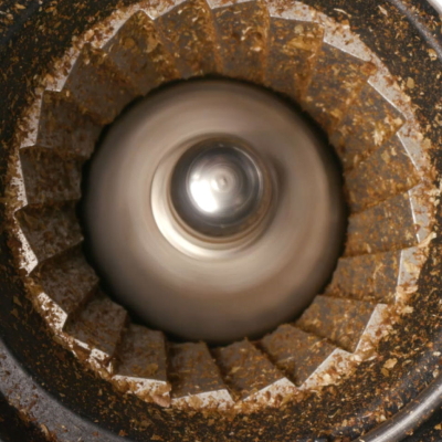 Coffee grinds in a burr coffee grinder