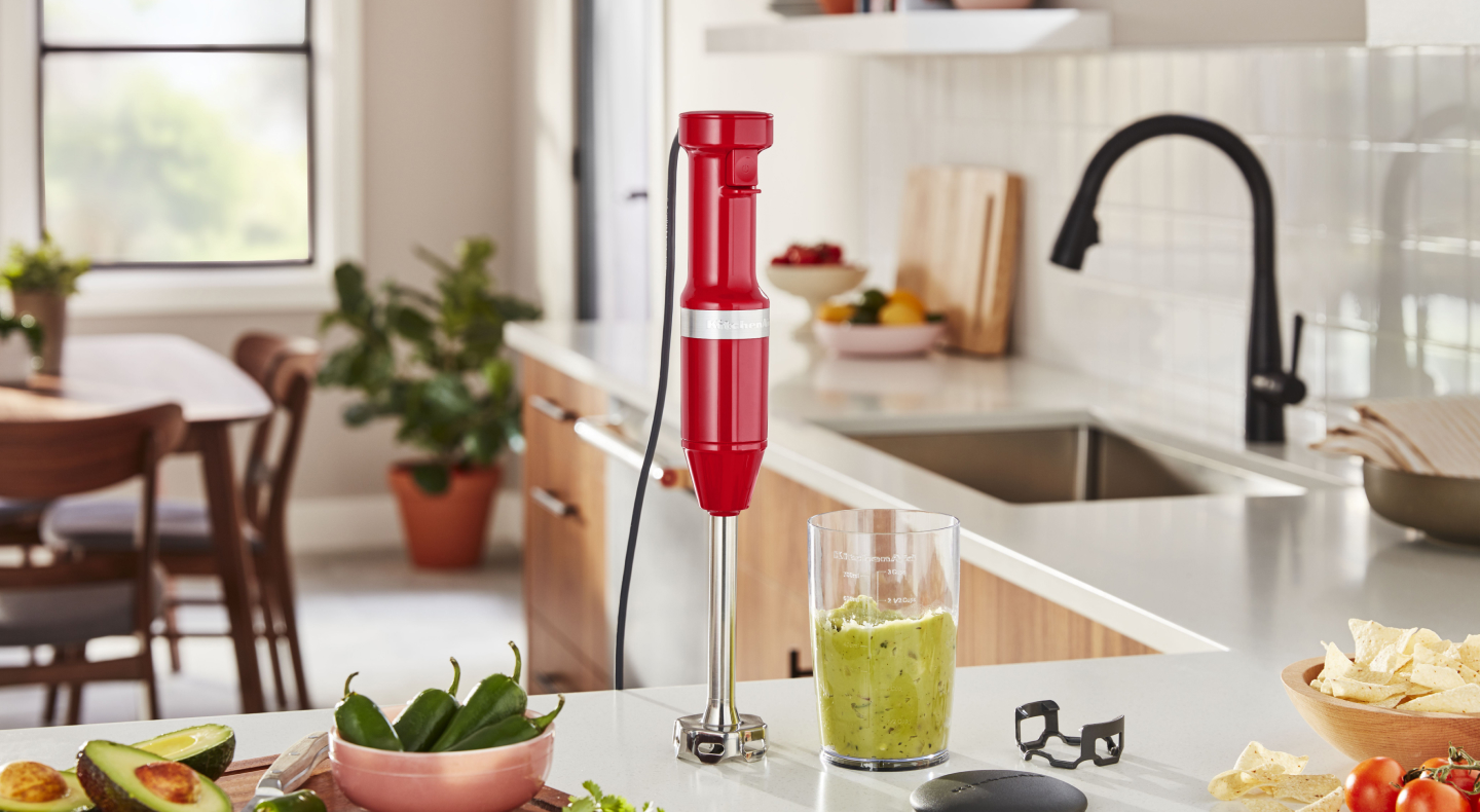 KitchenAid® hand blender next to green smoothie on countertop KitchenAid® hand blender next to green smoothie on countertop