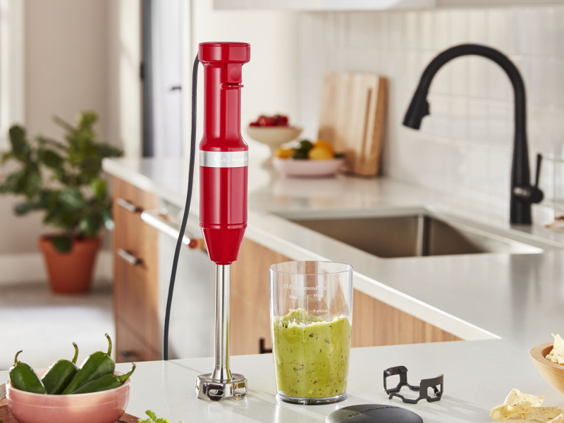 KitchenAid® hand blender next to green smoothie on countertop KitchenAid® hand blender next to green smoothie on countertop