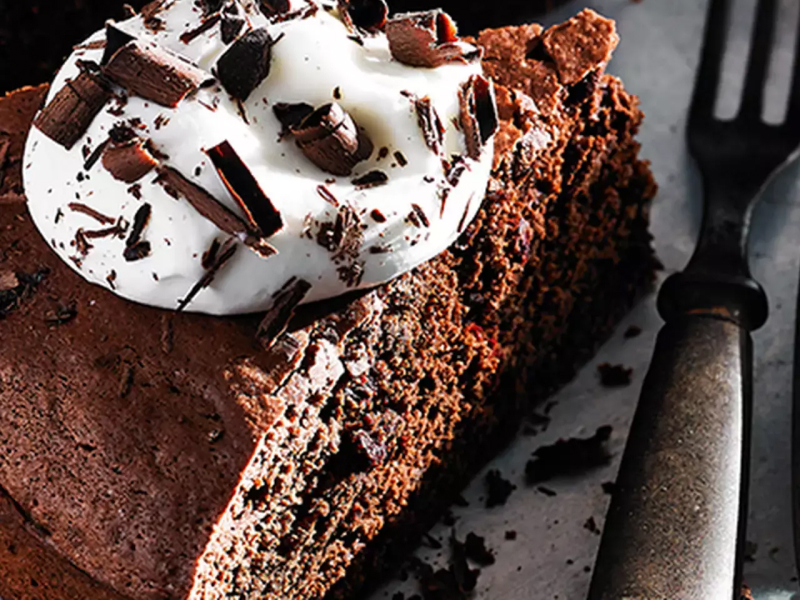 Chocolate dessert with whipped cream and chocolate shavings