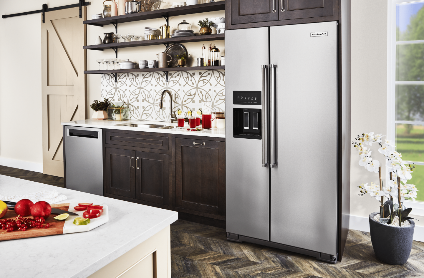 Stainless steel KitchenAid® side-by-side refrigerator next to kitchen sink countertop Stainless steel KitchenAid® side-by-side refrigerator next to kitchen sink countertop