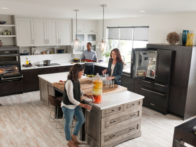 Group of people in an open concept kitchen Group of people in an open concept kitchen