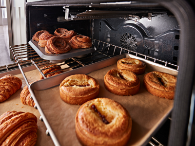 Baked goods on the inside of an oven Baked goods on the inside of an oven