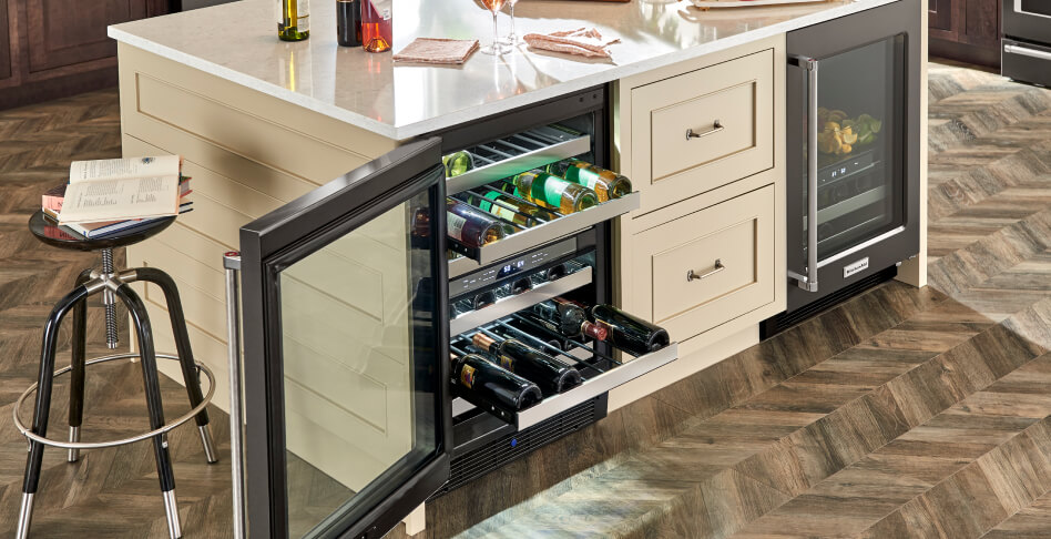 Wine refrigerator with top and bottom racks filled with wine Wine refrigerator with top and bottom racks filled with wine