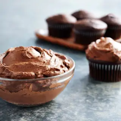 Espresso buttercream frosting in a glass bowl