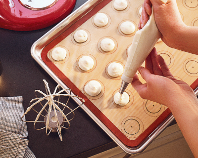 German buttercream piped onto a baking sheet