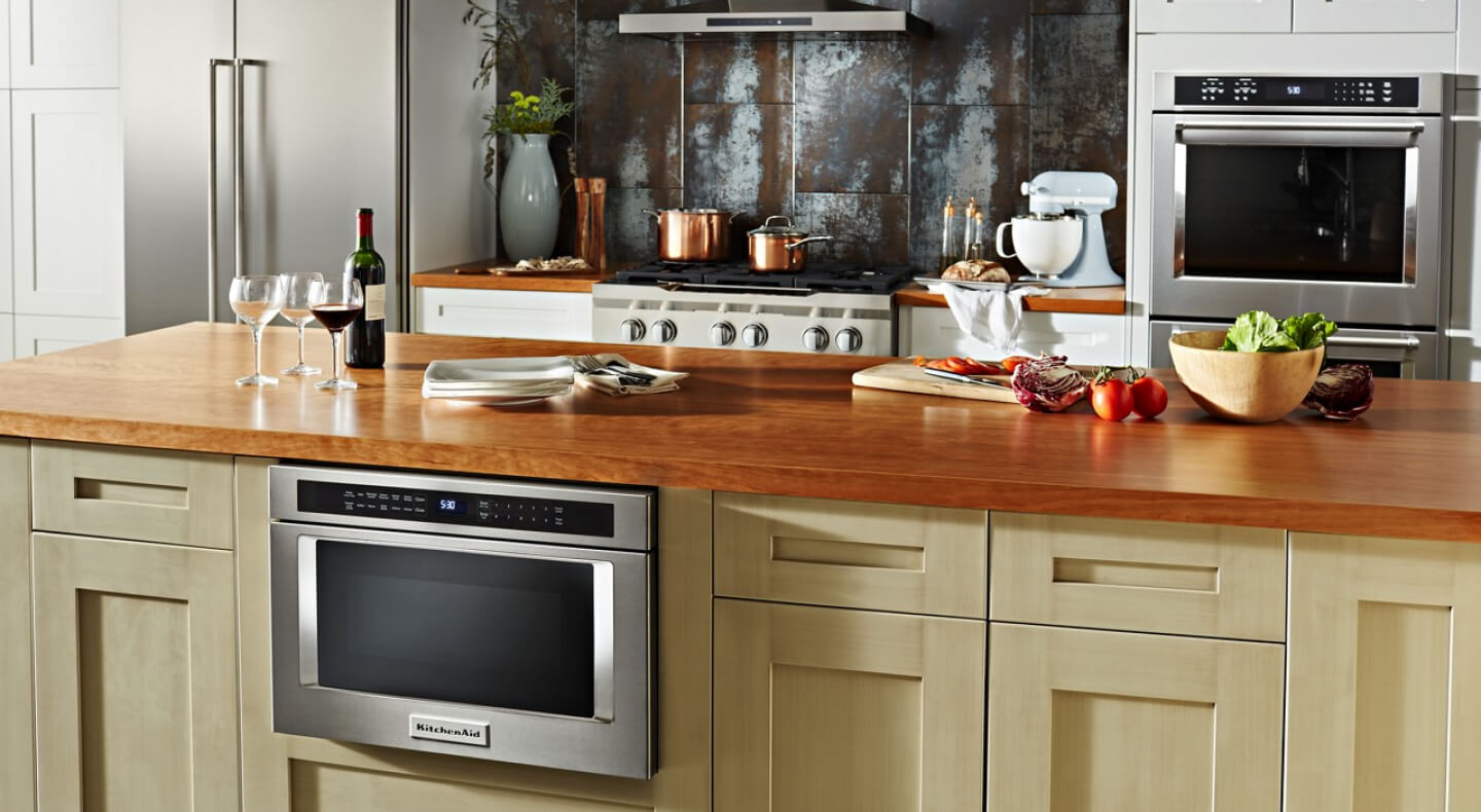 A KitchenAid® microwave drawer in a kitchen with various other KitchenAid® appliances