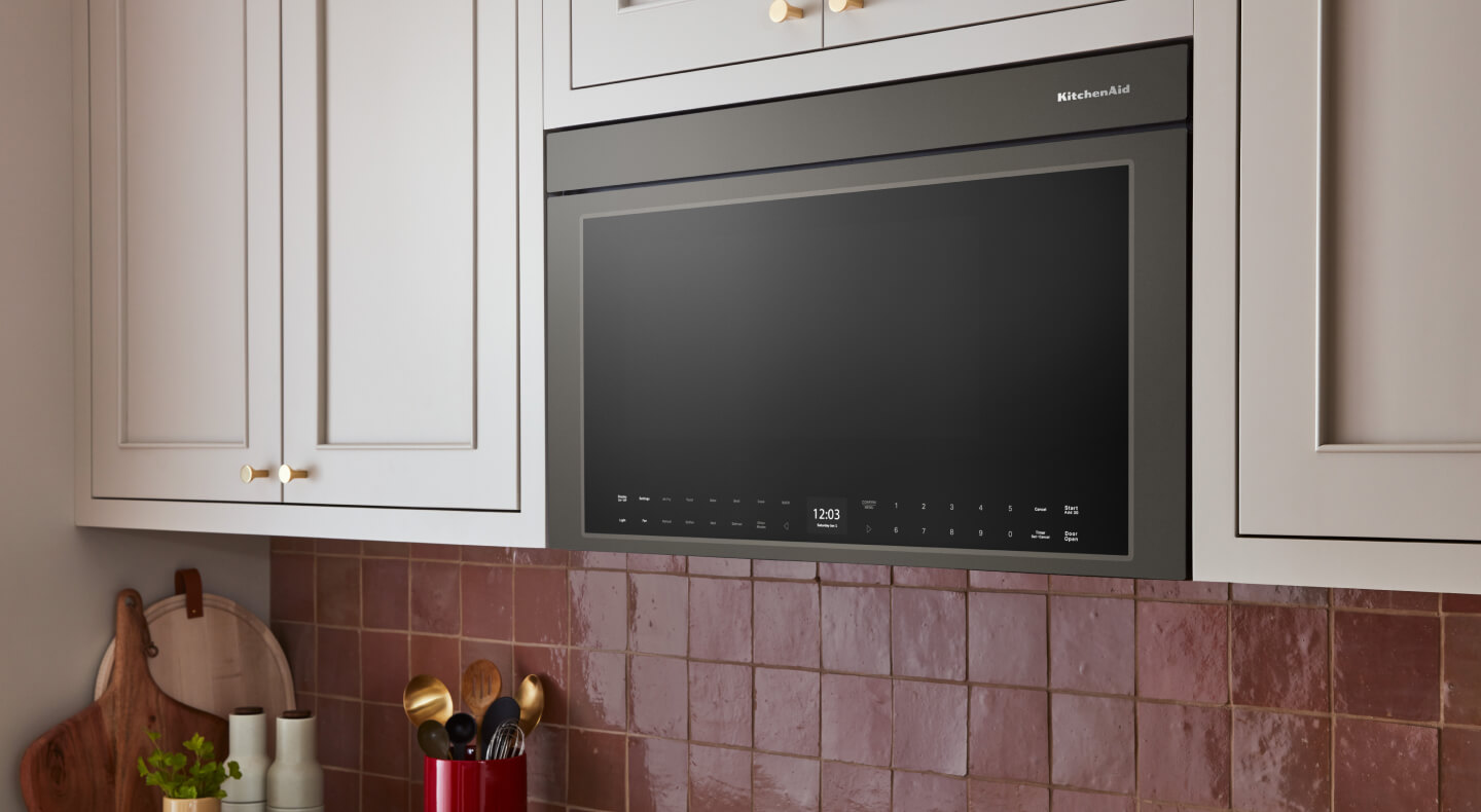 KitchenAid® over-the-range microwave built into cream-colored cabinetry KitchenAid® over-the-range microwave built into cream-colored cabinetry