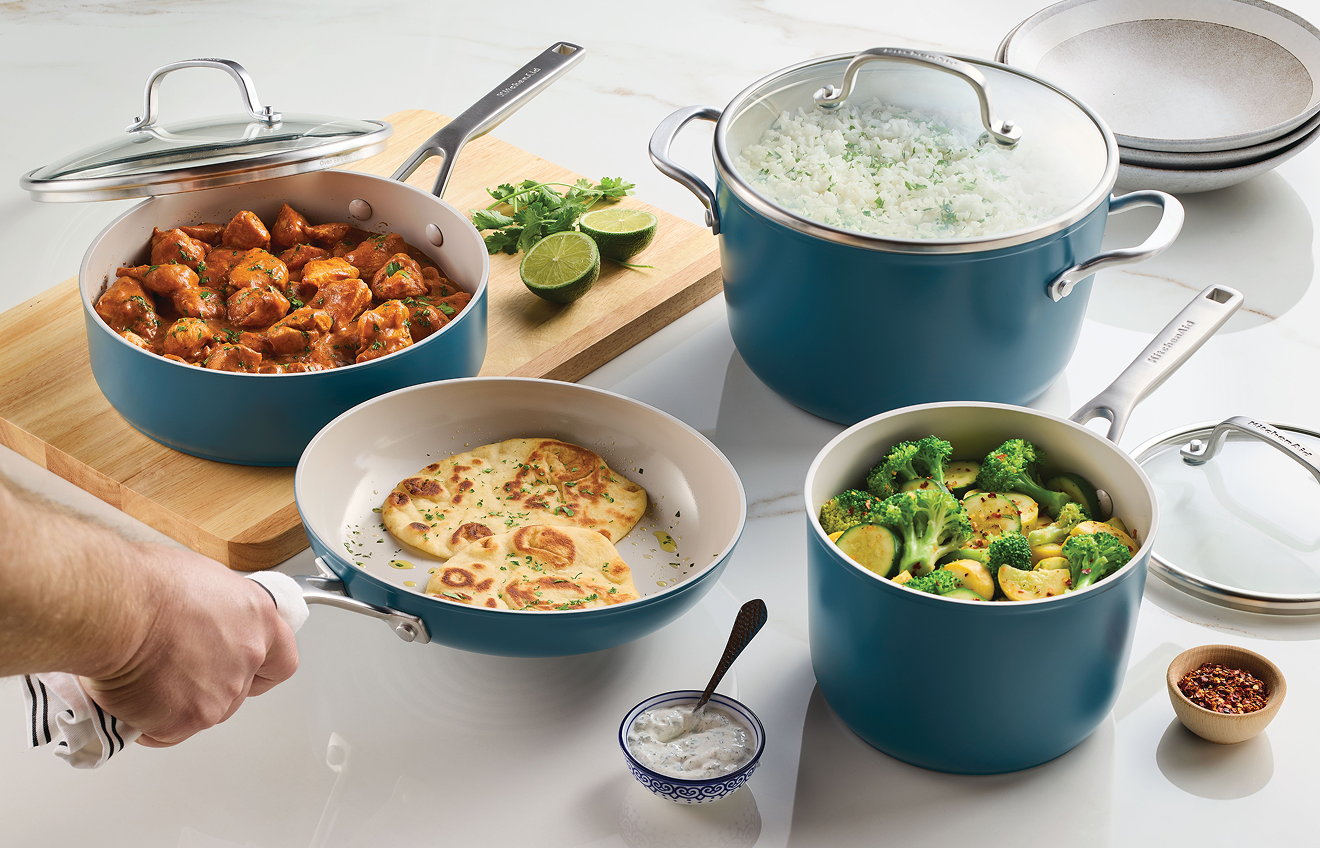 Person preparing a meal with KitchenAid® Ceramic Nonstick Cookware