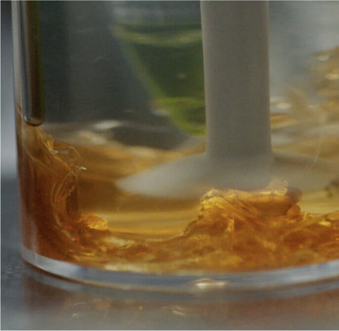 A sample of honey being tested in a lab.