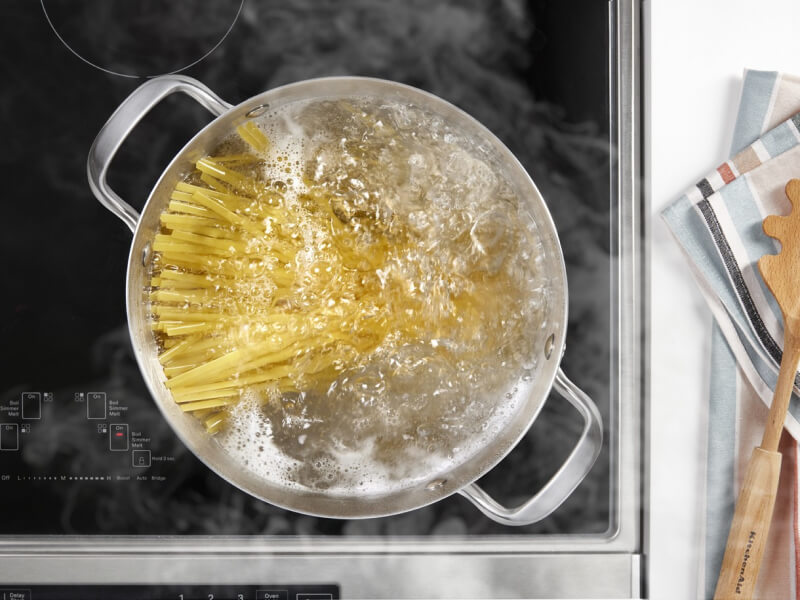 Pasta boiling in a pot on an induction cooktop