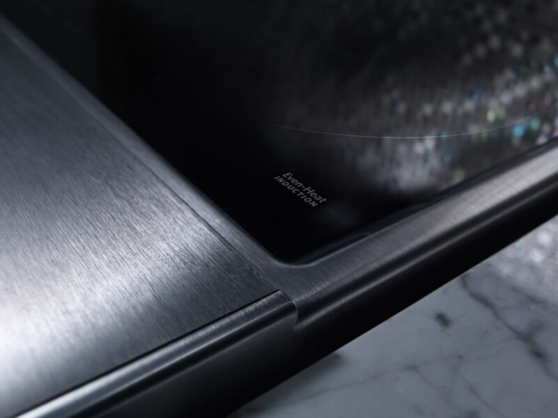 Closeup of an induction cooktop’s surface