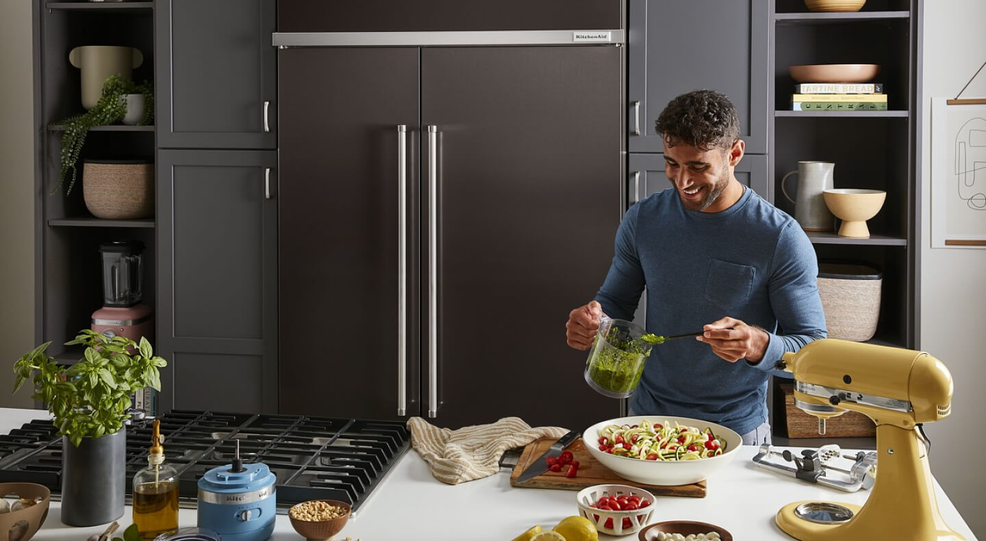 Person preparing food at an island