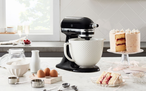 Black KitchenAid® stand mixer on counter with baking ingredients