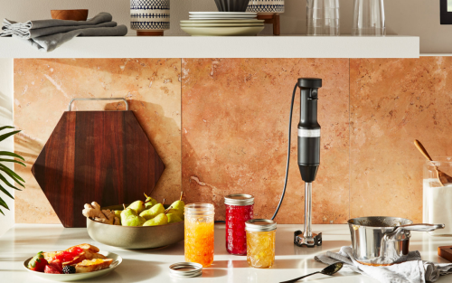 KitchenAid® immersion blender on countertop with jam jars and jam ingredients