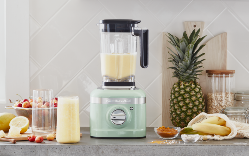 Mint green KitchenAid® countertop blender with surrounding ingredients