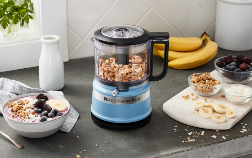 A KitchenAid® food processor with ground almonds and ground-almond dish