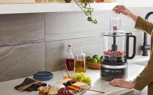 A countertop with a full charcuterie board spread