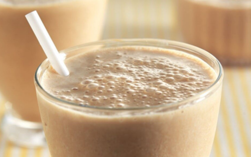 Frappe in a glass with a straw