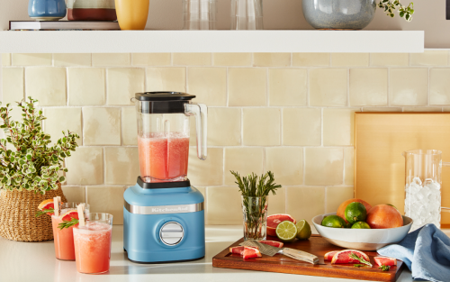 Slushie ingredients on a counter next to a blender