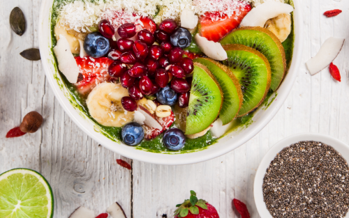 Smoothie bowl topped with a variety of fresh fruits