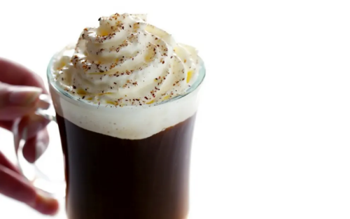 Irish coffee topped with whipped cream and chocolate flakes