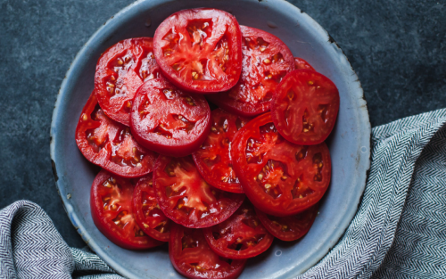 Sliced tomatoes on a plate.