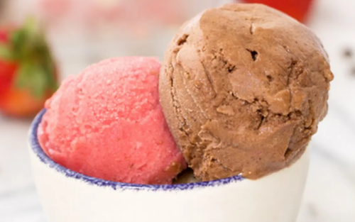 A closeup of a scoop of chocolate and strawberry nice cream