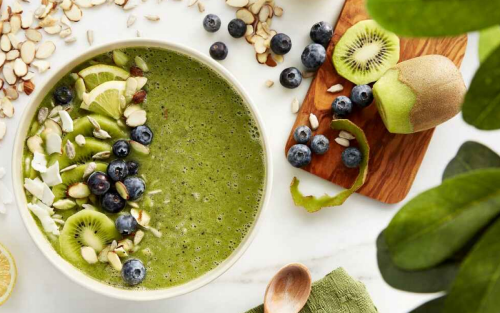 Smoothie bowl next to fresh fruit