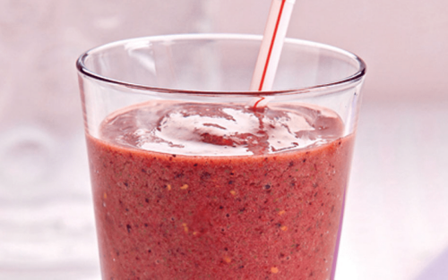 Pink smoothie with a straw