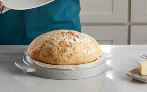 Homemade artisanal bread in a KitchenAid® Bread Bowl on a modern kitchen counter