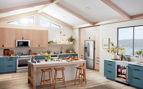 Kitchen with gray cabinets, kitchen island and stainless appliances