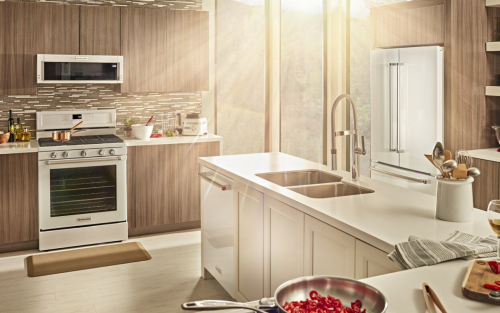 White KitchenAid® appliances in a bright and neutral kitchen