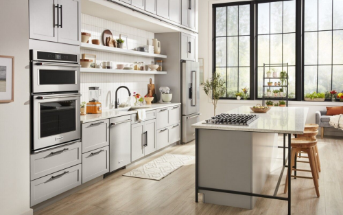 KitchenAid® appliances in a black and white themed kitchen.