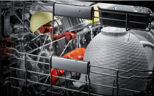 Close-up of dishes rinsing in a dishwasher