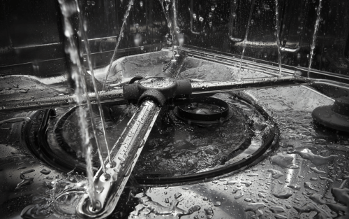 Closeup image of a dishwasher spray arm and filter